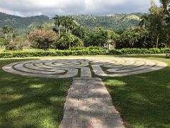 05B The labyrinth with the green hills of Kingston behind in the Sunken Garden Royal Botanical Hope Gardens Kingston Jamaica